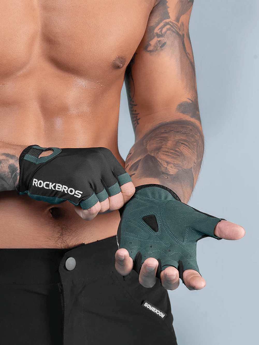 Unisex green half-finger cycling gloves SF2627 enhance grip and breathability, worn by a model showcasing their efficiency.