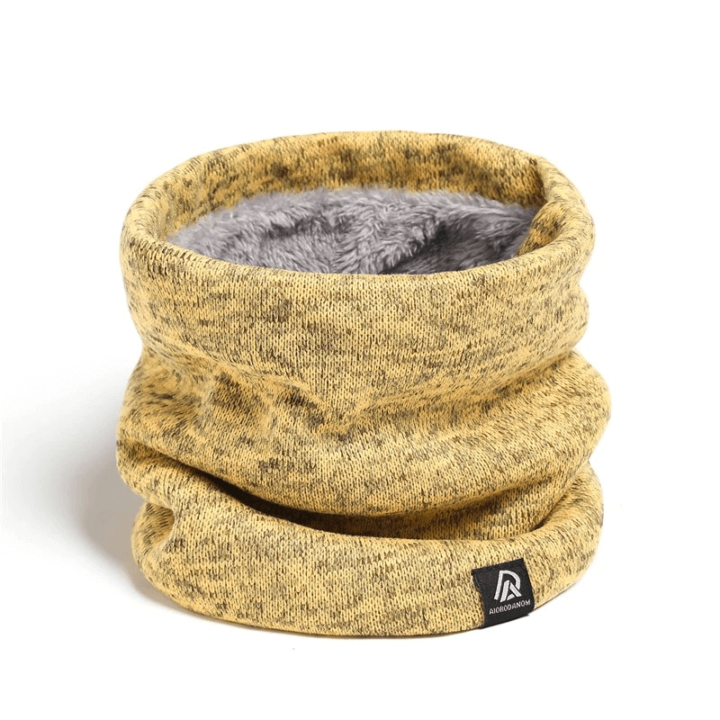 Cozy fleece-lined knitted neck warmer in mustard yellow, designed for winter warmth and versatility, with a trendy solid pattern.
