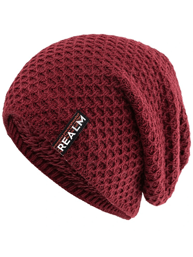 Cozy unisex knitted hat with letter label, thermal lining, and dot pattern, perfect for outdoor adventures and keeping warm.