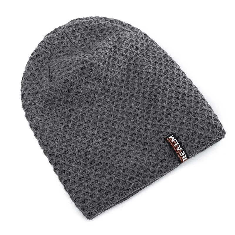 Unisex thermal lined knitted hat with dot pattern and letter label, ideal for outdoor adventures. Warm acrylic material. Style SF1669.
