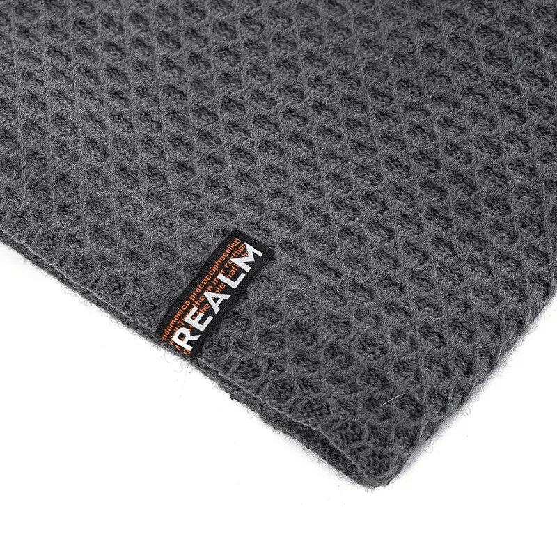 Close-up of unisex thermal lined knitted hat with letter label decor and dot pattern, perfect for warm outdoor adventures, Model SF1669.