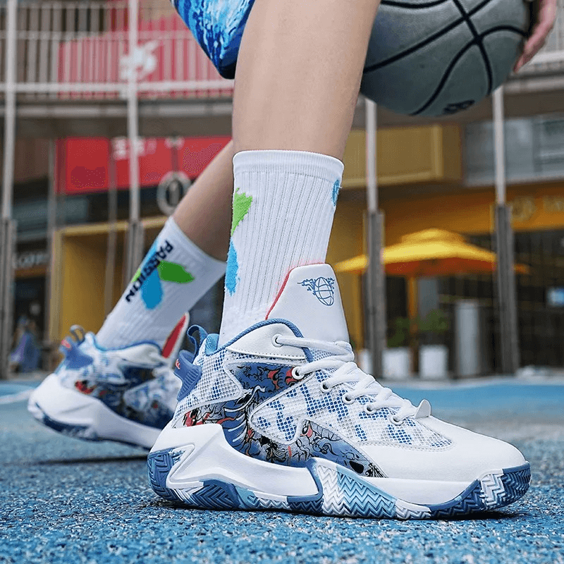 Person wearing unisex lightweight breathable non-slip sports sneakers SF1902 while playing basketball on an outdoor court.