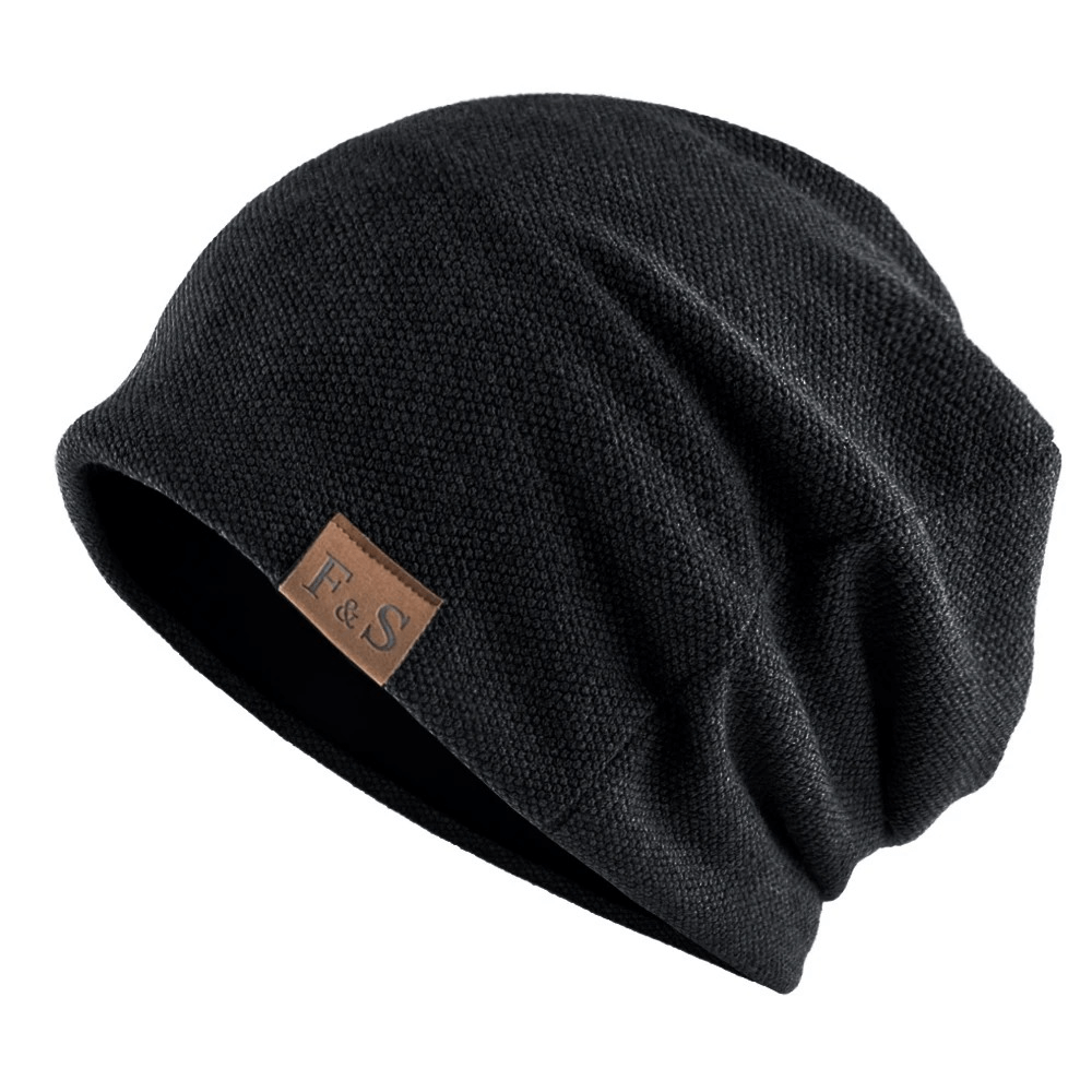 Unisex solid color knit beanie in black with leather tag, perfect for casual wear and spring days, made from cotton-polyester blend. SF2415