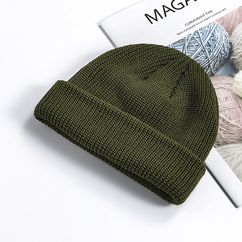 Unisex solid color warm knitted cotton brimless hat in olive green, perfect for outdoor activities and keeping warm. Model SF1393.