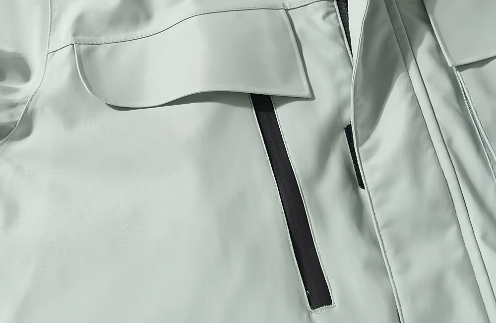 Close-up of a waterproof skiing jacket with zippered pockets, emphasizing durable polyester and windproof features for outdoor use.