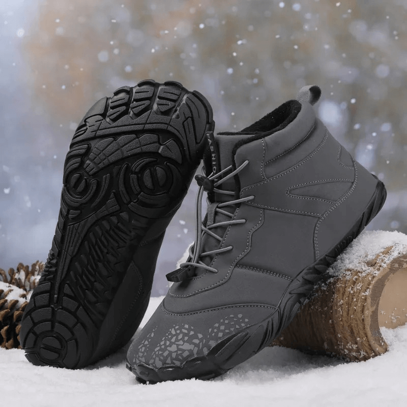 Unisex waterproof hiking boots with non-slip rubber sole on snow, showcasing durability and versatile outdoor style for men and women.