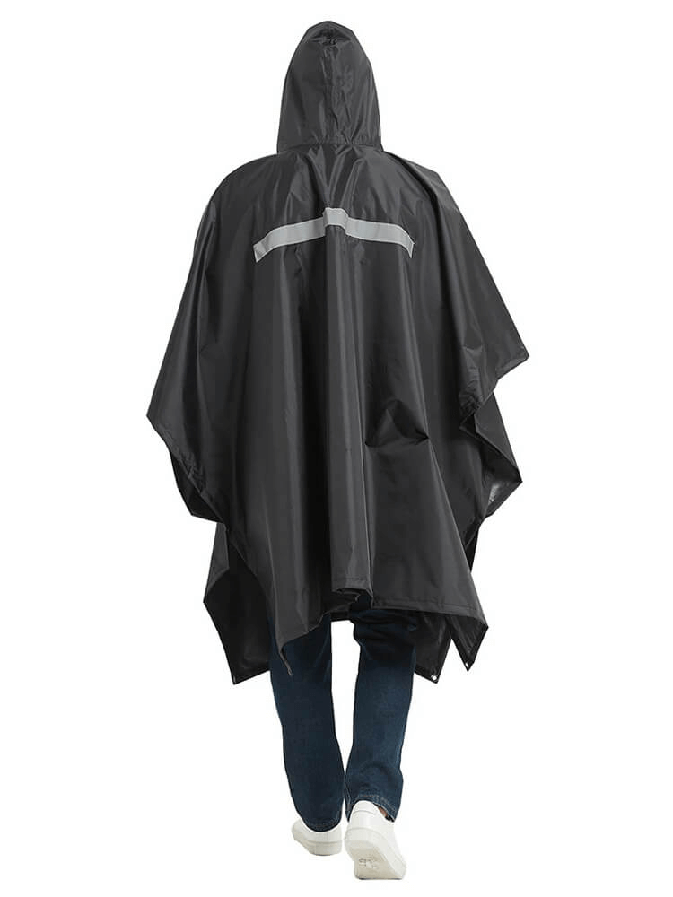 Person wearing black unisex waterproof hooded raincoat-poncho, showcasing its durable and portable design for outdoor activities.