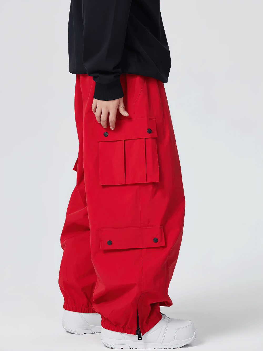 Model wearing Unisex Waterproof Snowboard Cargo Pants - SF4236 in vibrant red with multiple pockets for style and practicality.