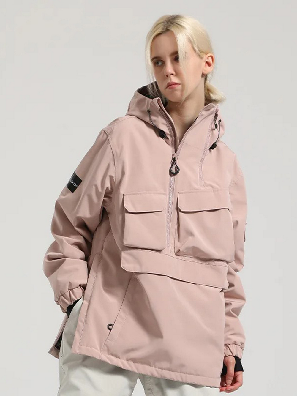 Model wearing unisex windproof waterproof ski jacket SF2067 in light pink, featuring front pockets and hood, perfect for outdoor adventures.