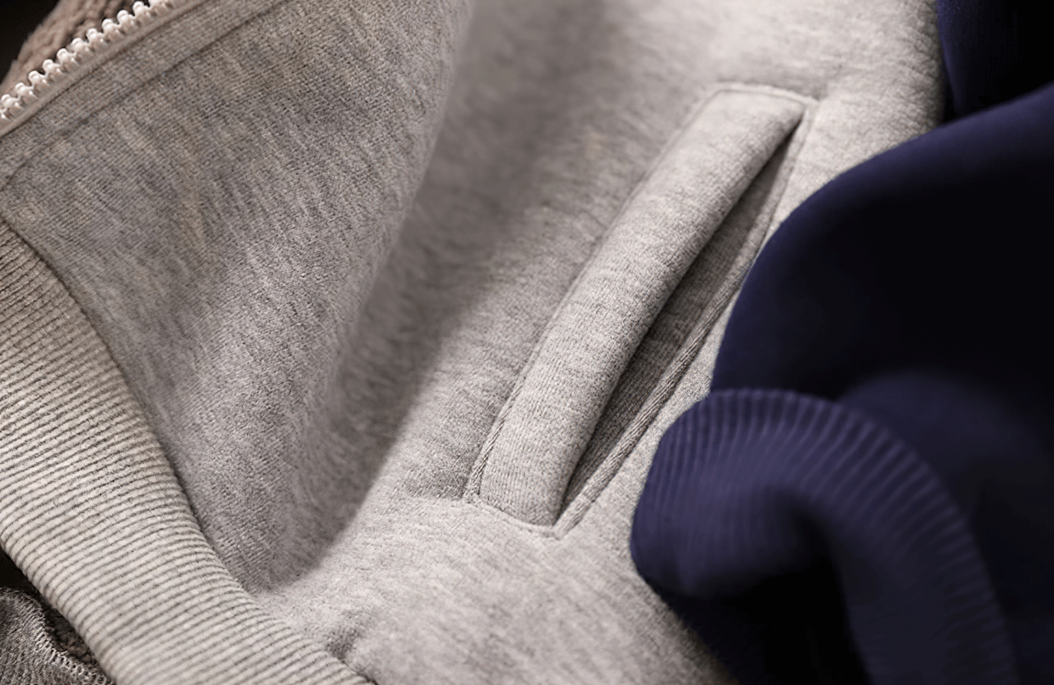 Close-up of Unisex Zip-Up Hooded Sweatshirt with Fleece Lining - SF3712 showing fleece texture and pocket detail.