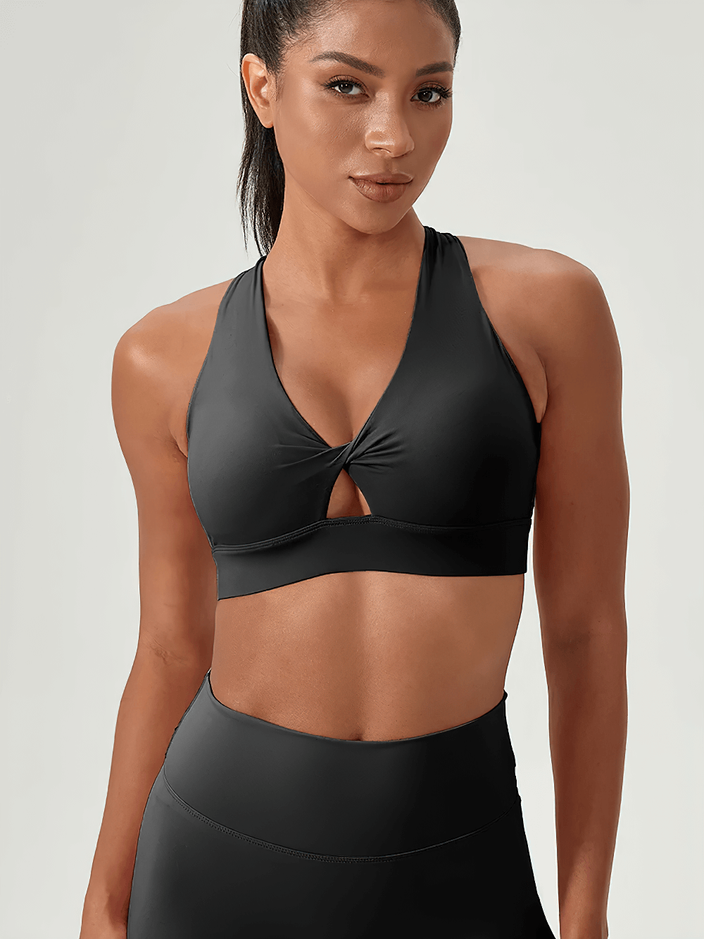 Woman wearing V-Neck Twist Front Sports Bra with Racerback Design - SF4043, ideal for gym workouts, yoga, and casual wear.
