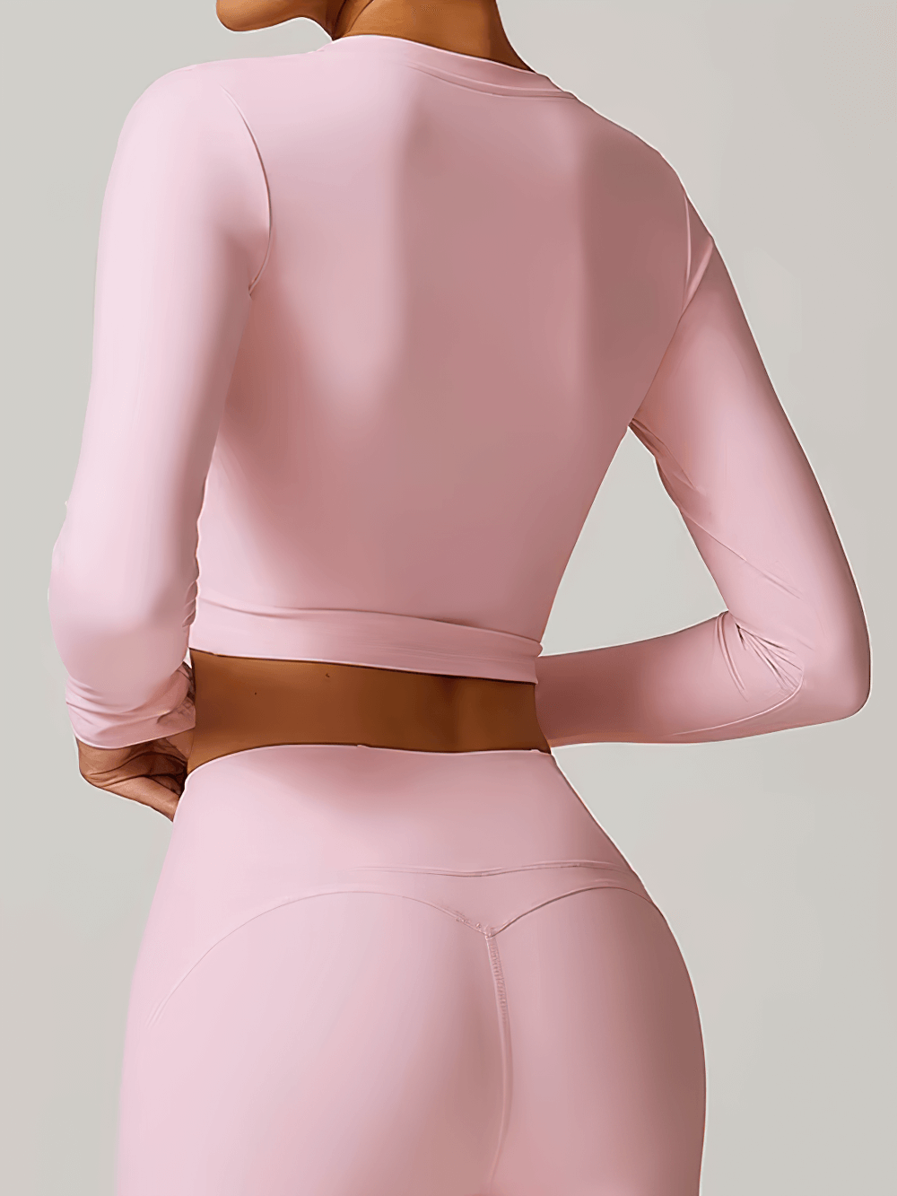 Back view of pink V-Neck Yoga Long Sleeve Crop Top for Women - perfect for running, yoga, and fitness with durable, stretchy fabric.