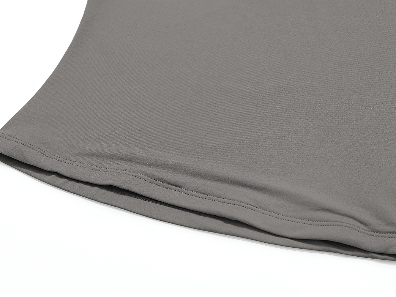Close-up of a charcoal gray V-Neck Yoga Tee's hemline, ideal for fitness enthusiasts. Breathable, quick-drying nylon-spandex blend fabric.