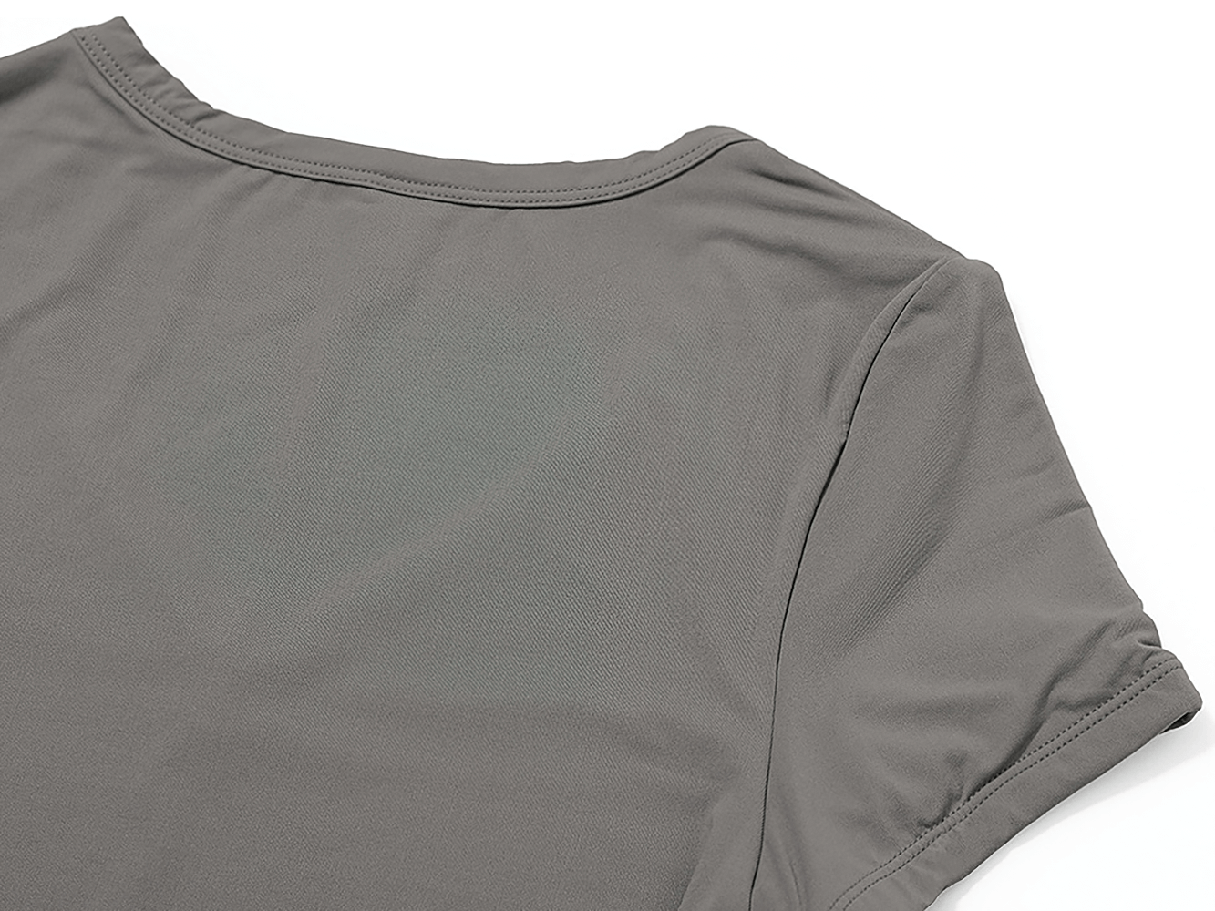 Women's sport V-neck yoga tee in gray, perfect for fitness. Made with nylon and spandex, featuring short sleeves and quick-dry fabric.