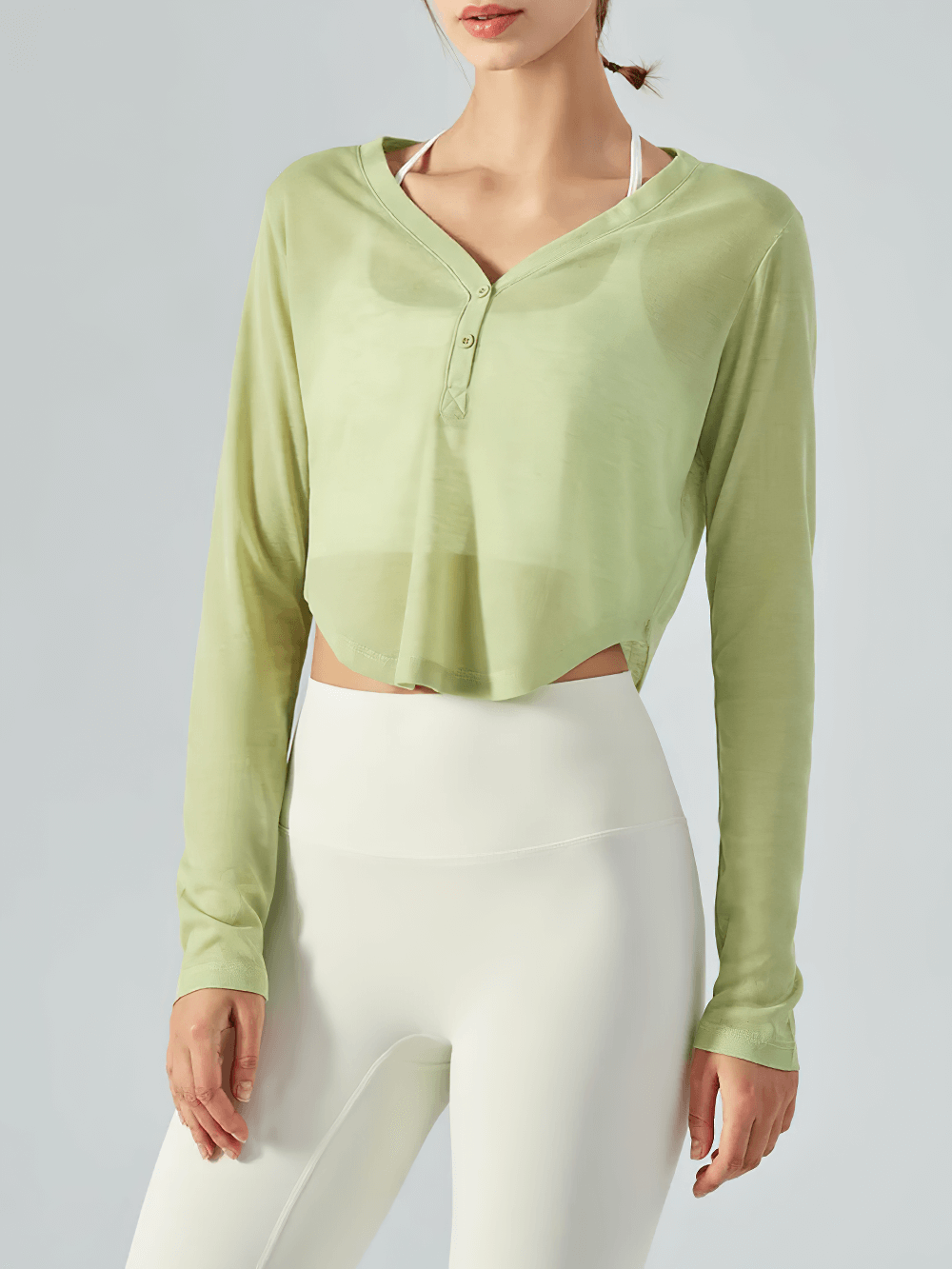 V-Neck Yoga Top with Curved Hem and Long Sleeves in Light Green, perfect for fitness and casual wear.