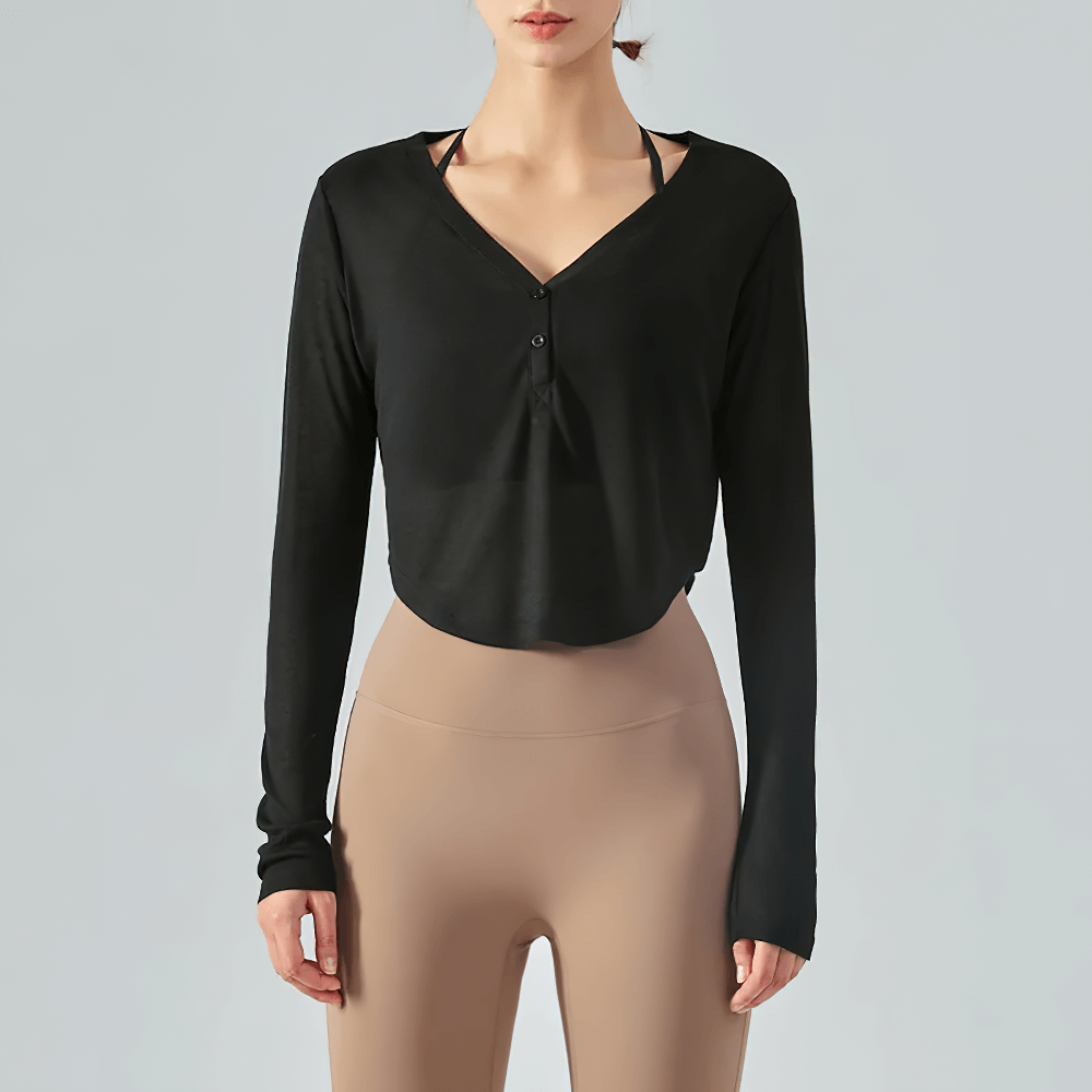 Breathable black V-neck yoga top with curved hem and long sleeves, ideal for fitness and casual wear.