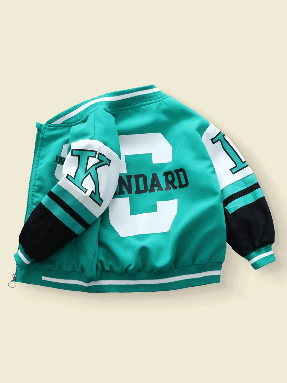 Kids varsity bomber jacket with bold lettering and graphic prints, featuring prominent "C" design in sporty colors.