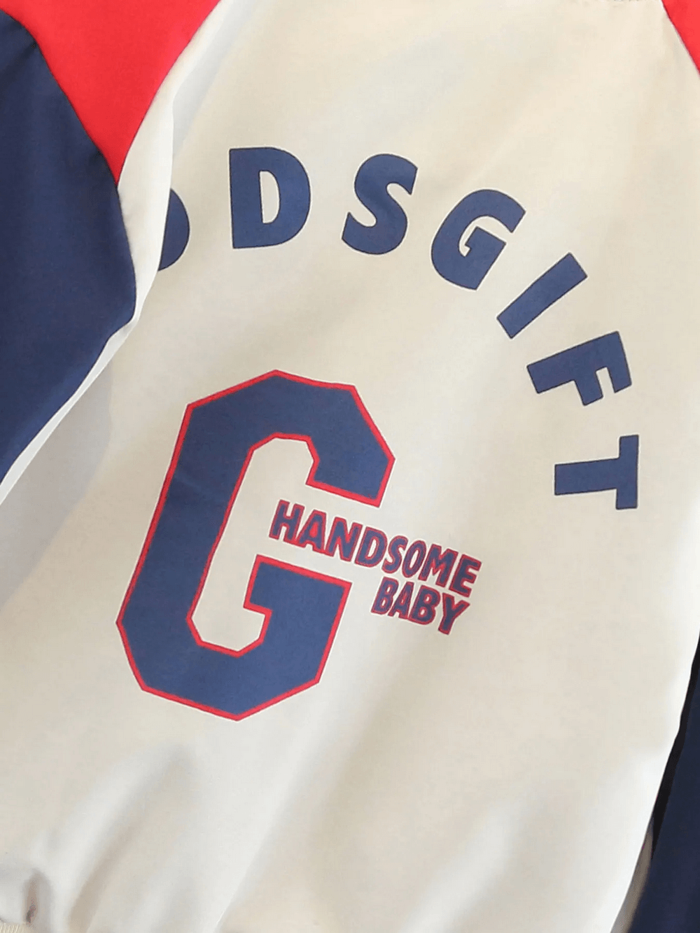 Varsity style kids bomber jacket with 'HANDsome Baby' and 'G' letter print in navy, red, and beige color-block design.