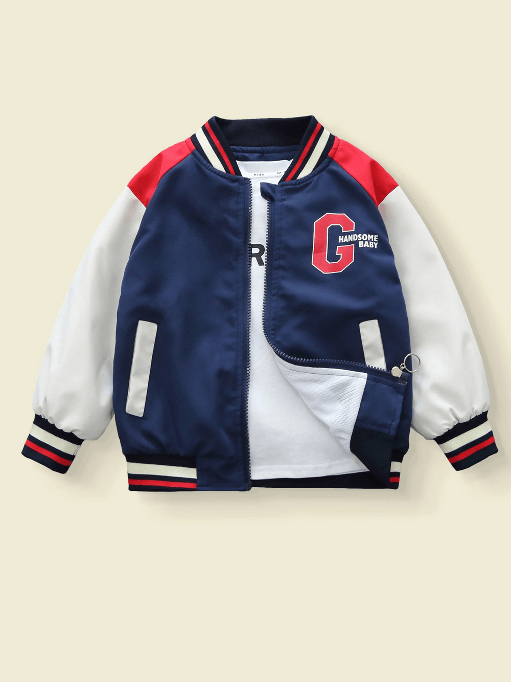 Color-blocked varsity jacket for kids with navy, red, and beige design, featuring a bold G print and "HANDsome Baby" on the chest.
