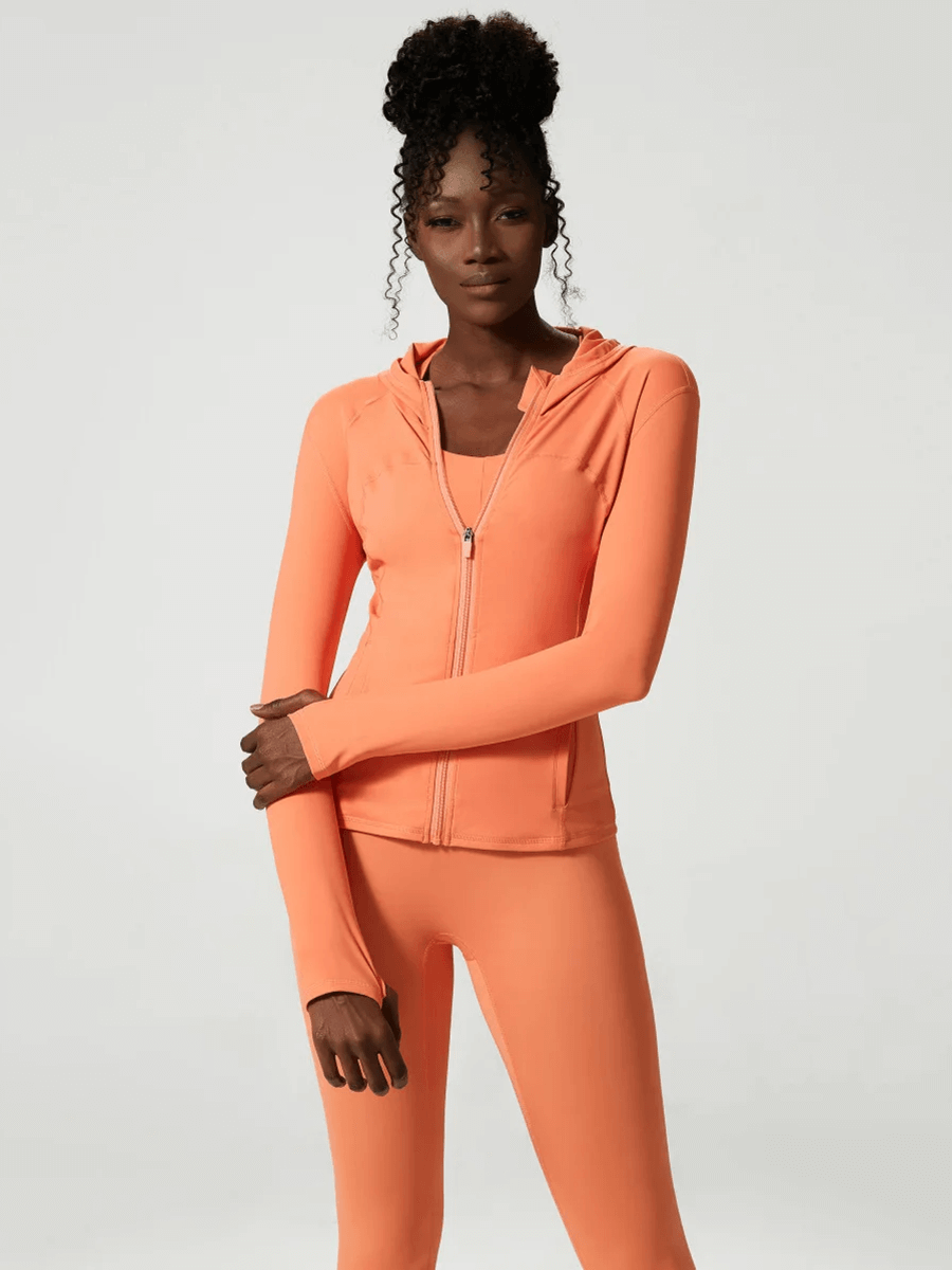Woman wearing orange versatile yoga and gym activewear set SF2080, featuring full-sleeve top and pants, ideal for all fitness levels.