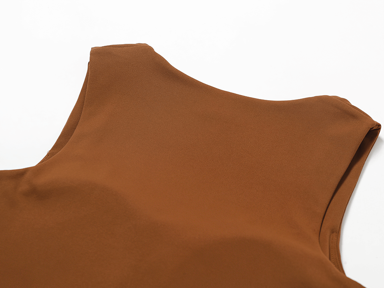 Close-up of a versatile brown workout crop tank for active women, highlighting sleek design and breathable material.