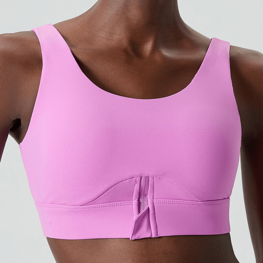 Vibrant Yoga Fitness Bra in solid pink, featuring breathable Nylon-Lycra blend, designed for high-impact workouts and flexibility.