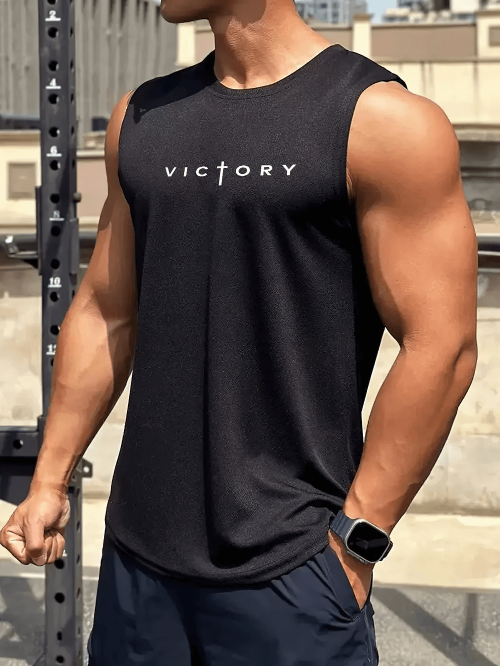 Man wearing Victory Print Gym Tank Top for Fitness and Training - SF4099, showcasing muscular physique in stylish sleeveless shirt.