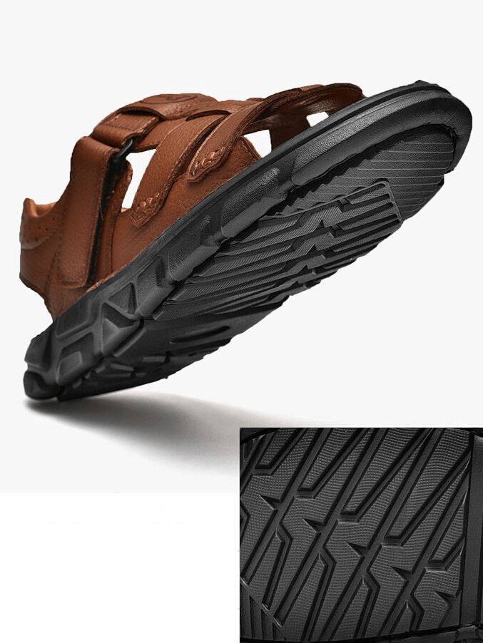 Vintage men's trekking sandal with soft rubber outsole and genuine leather upper, showcasing durable traction design for outdoor adventures.