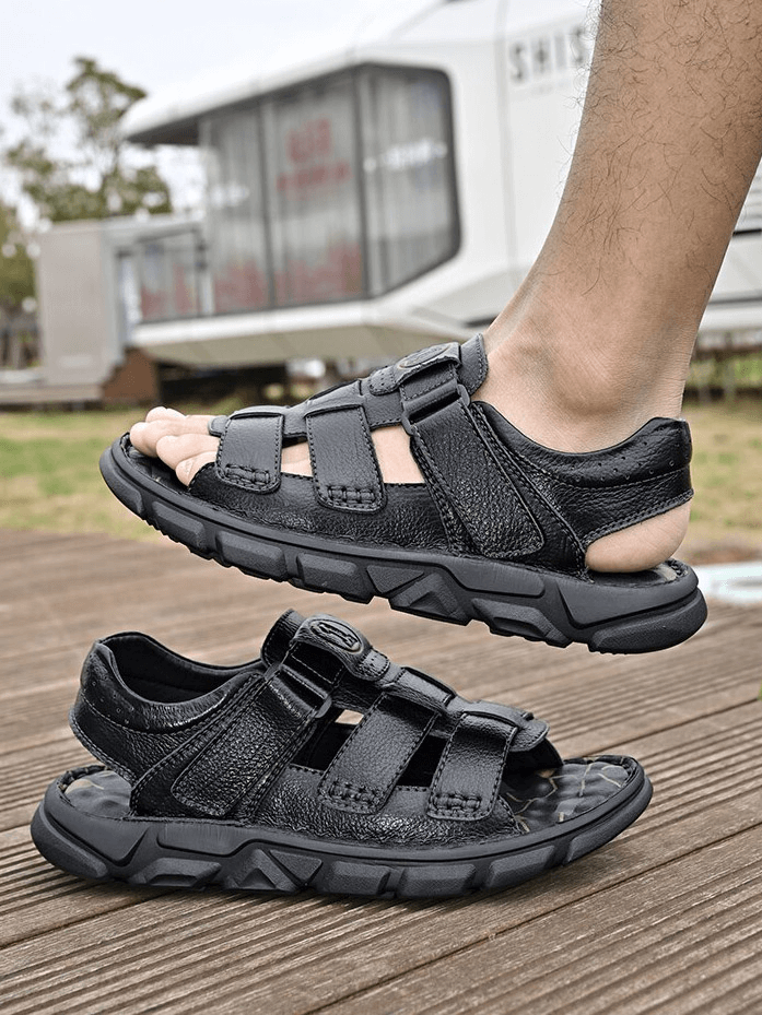 Vintage men's sandals on foot, crafted from leather with a soft bottom and rubber outsole, perfect for outdoor trekking.