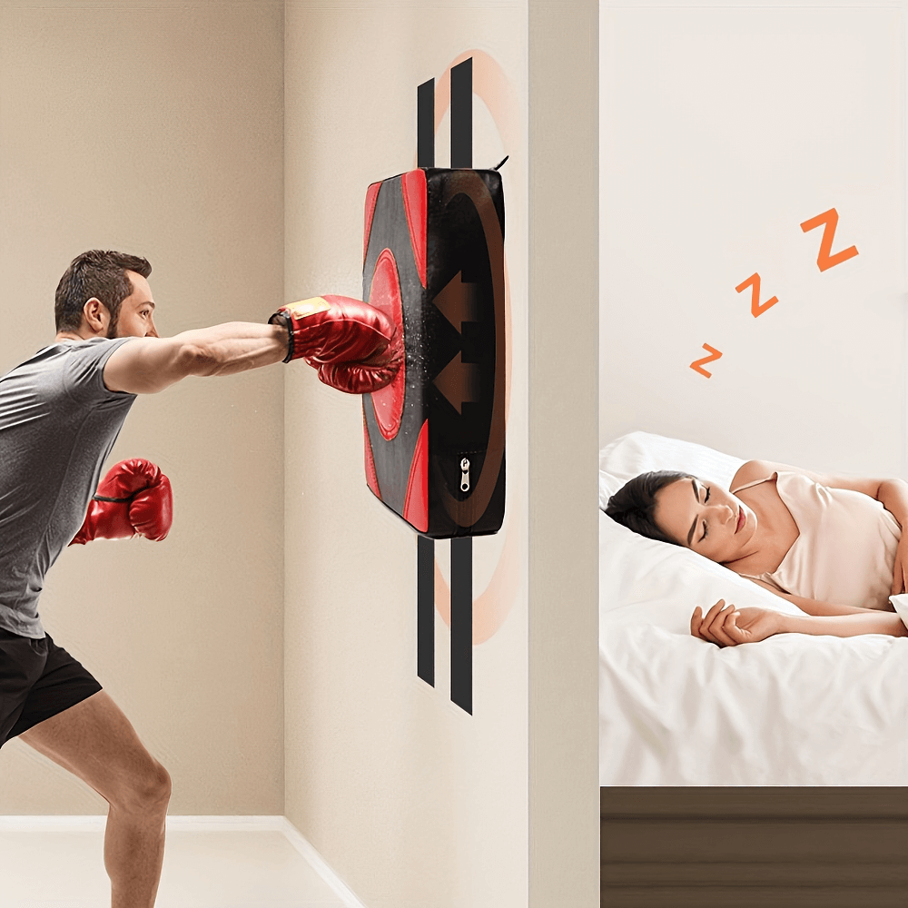 Man training with wall-mounted boxing pad, woman sleeping nearby; durable SF2723 boxing target with loop straps for easy setup.