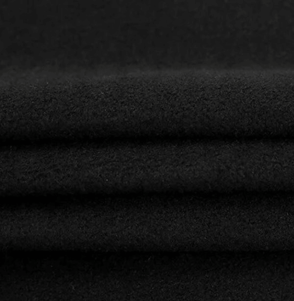 Close-up of soft, breathable black polyester fabric for women's sport long sleeve tops.