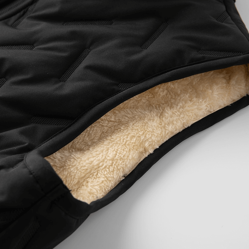 Close-up of a warm black lambswool vest with soft cashmere lining, featuring a stylish stand collar and zipper closure for casual comfort.