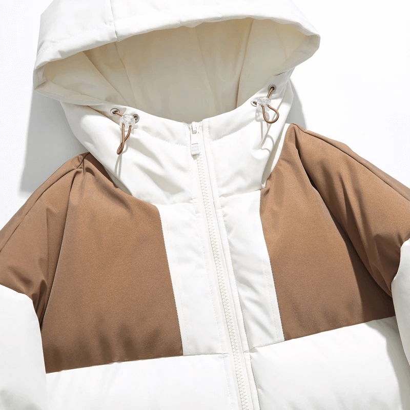Warm hooded zipper jacket with brown patchwork detailing, perfect for winter. Trendy and cozy with a blend of cotton and polyester.