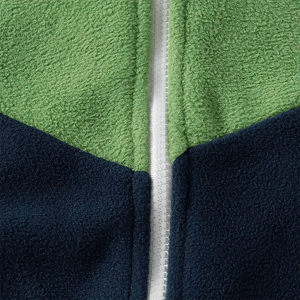 Close-up of a kids' fleece colorblock jacket in green and navy, showcasing the soft texture and stylish zip-up design for cold weather.