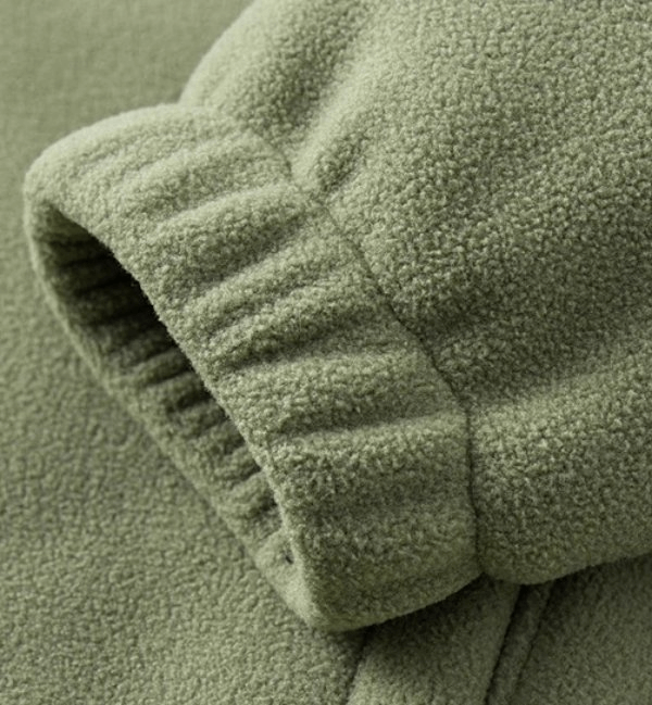 Close-up of a green warm sports fleece jacket sleeve, showcasing soft polyester fabric and elastic cuff detail, part of SF1889 model.