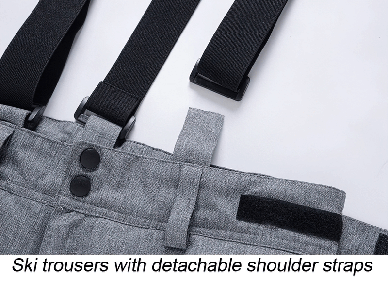 Close-up of warm ski trousers with detachable shoulder straps, showcasing durable design suitable for winter sports.