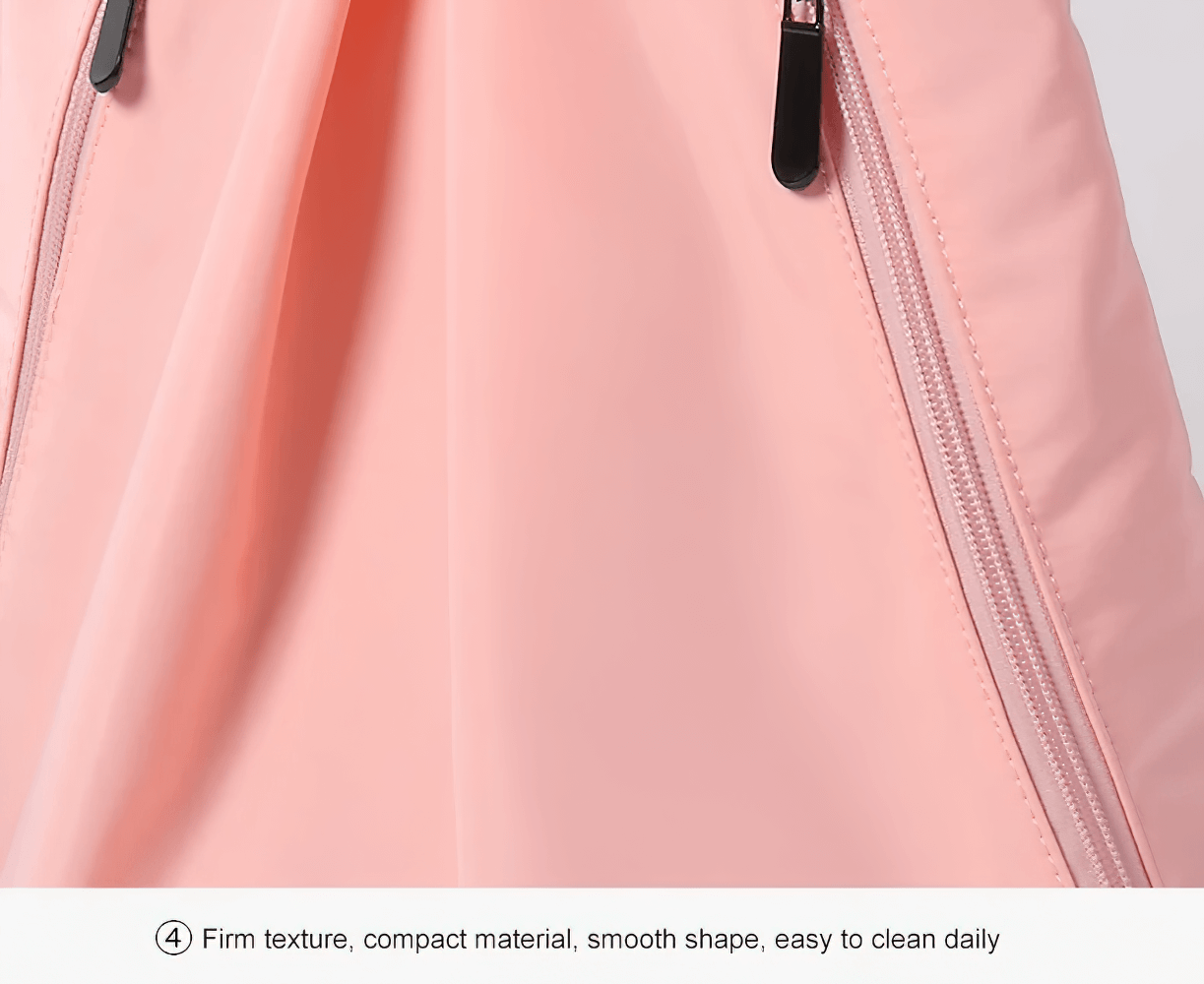 Close-up of a pink nylon backpack material with durable zippers, highlighting its firm texture and smooth, easy-to-clean surface.