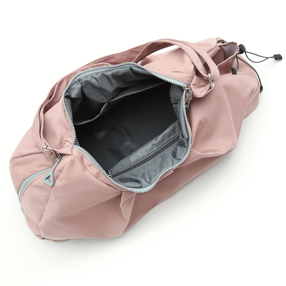 Pink waterproof fitness bag with zip closure and spacious interior, ideal for gym and travel. Made from durable Oxford material for women.