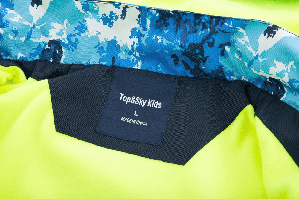 Inside view of a Waterproof Fleece Lined Jacket with Detachable Hood - SF3575, showing label and bright fleece lining.