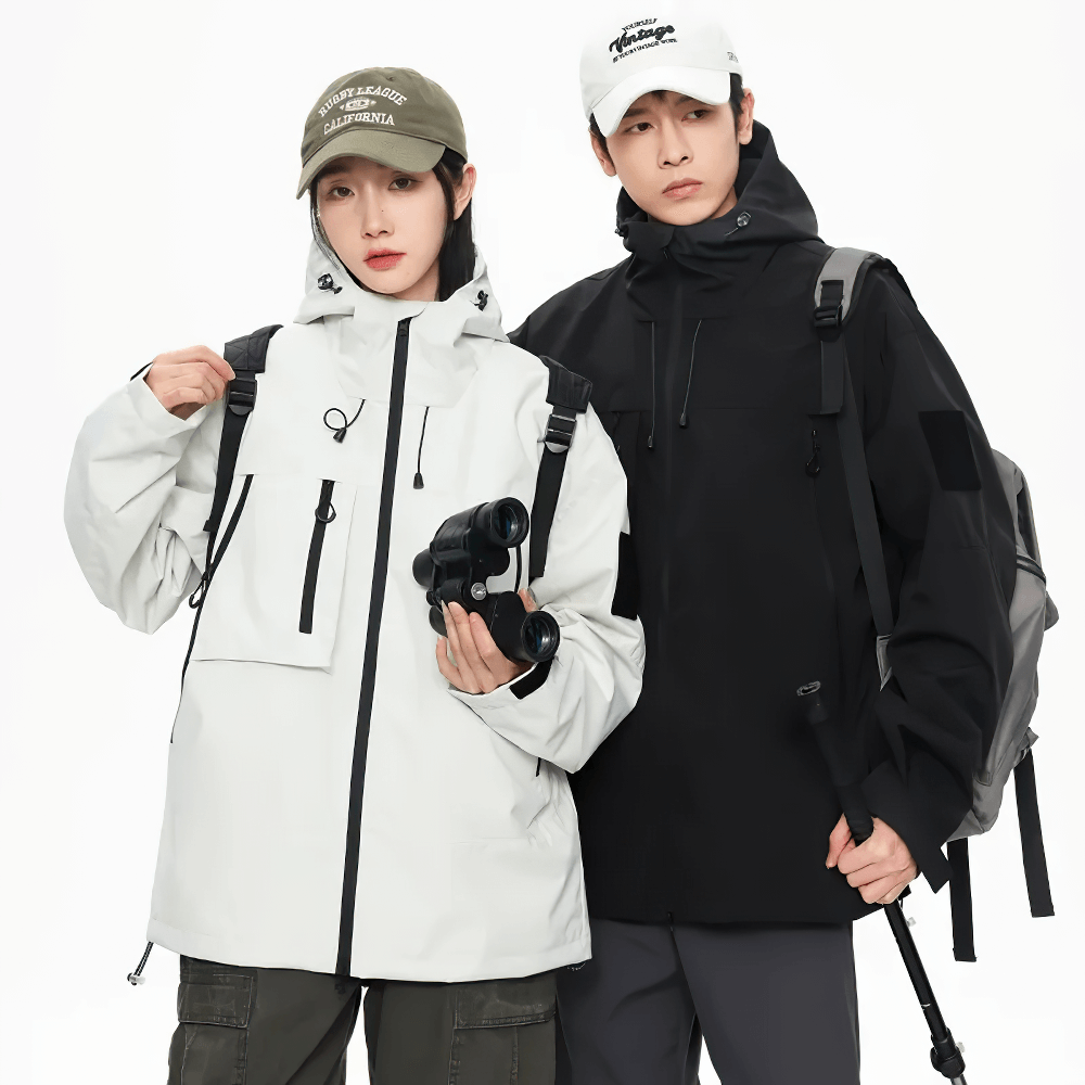 Two people wearing waterproof hiking jackets with hoods and pockets, perfect for outdoor activities like camping, cycling, and fishing.