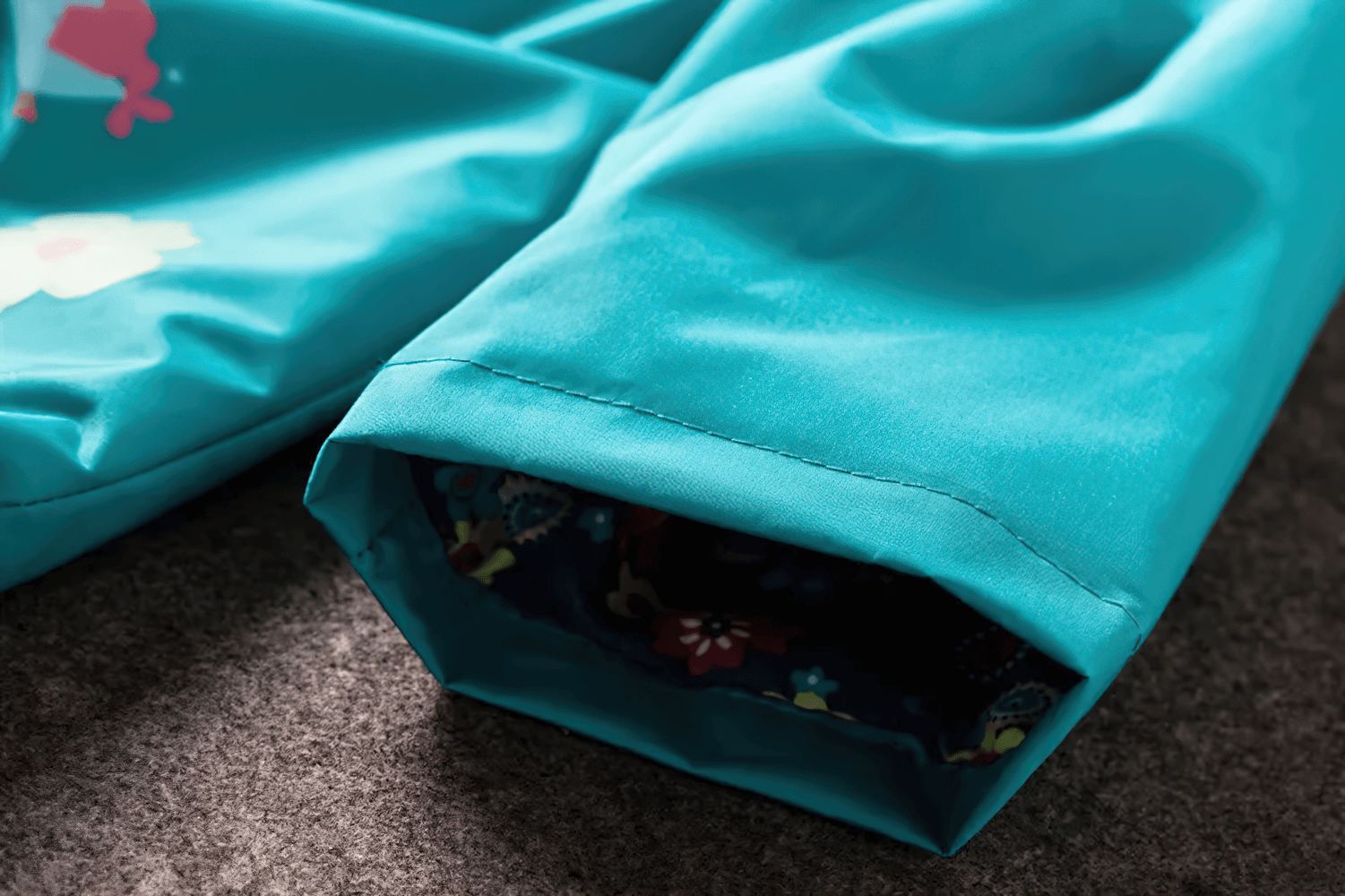 Close-up of sleeve on Waterproof Hooded Jacket with Cute Flower Print - SF3597, showcasing windproof design for kids' autumn adventures.