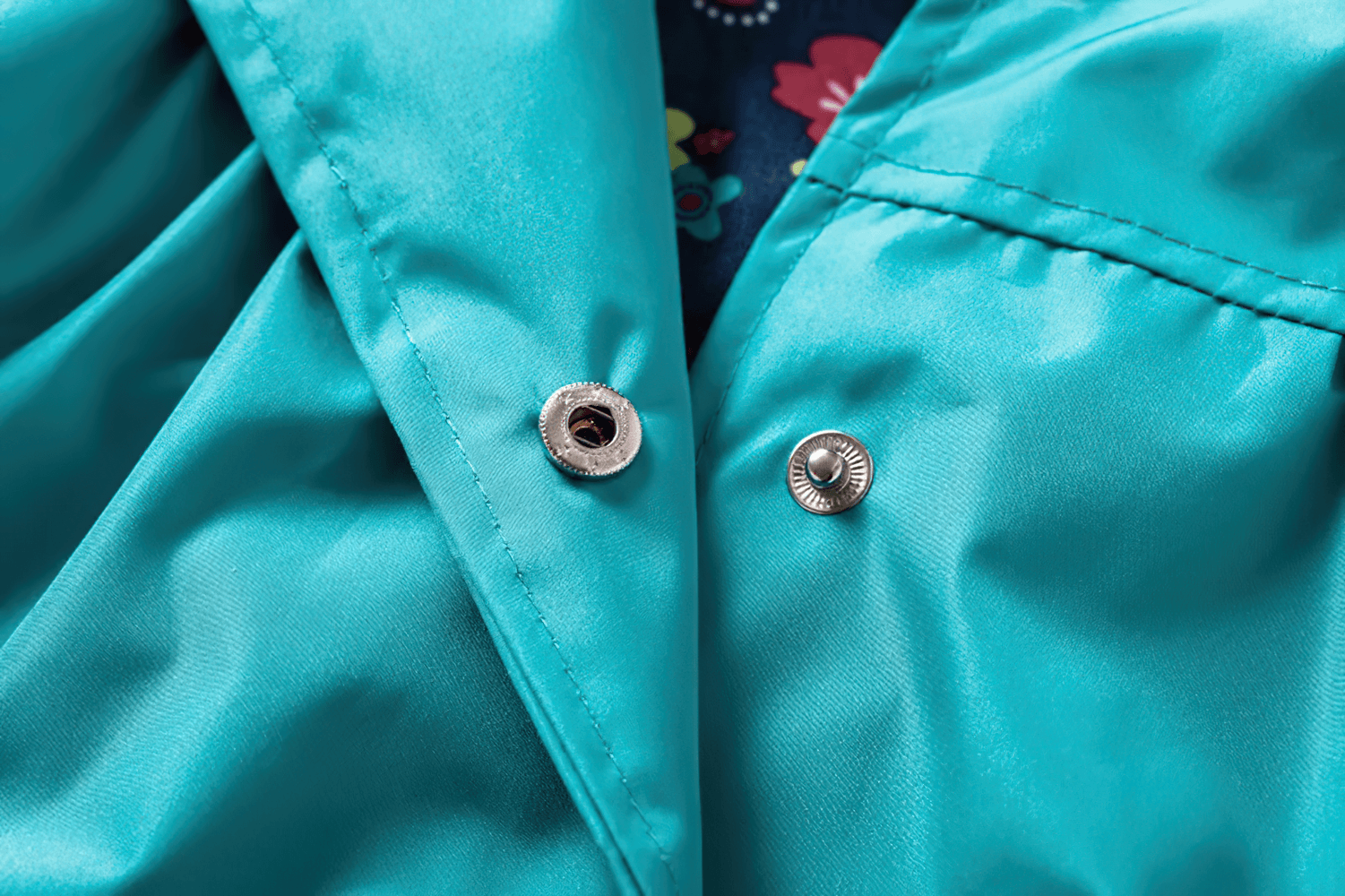 Close-up of waterproof snap buttons on Waterproof Hooded Jacket with Cute Flower Print - SF3597 for kids' autumn outwear.
