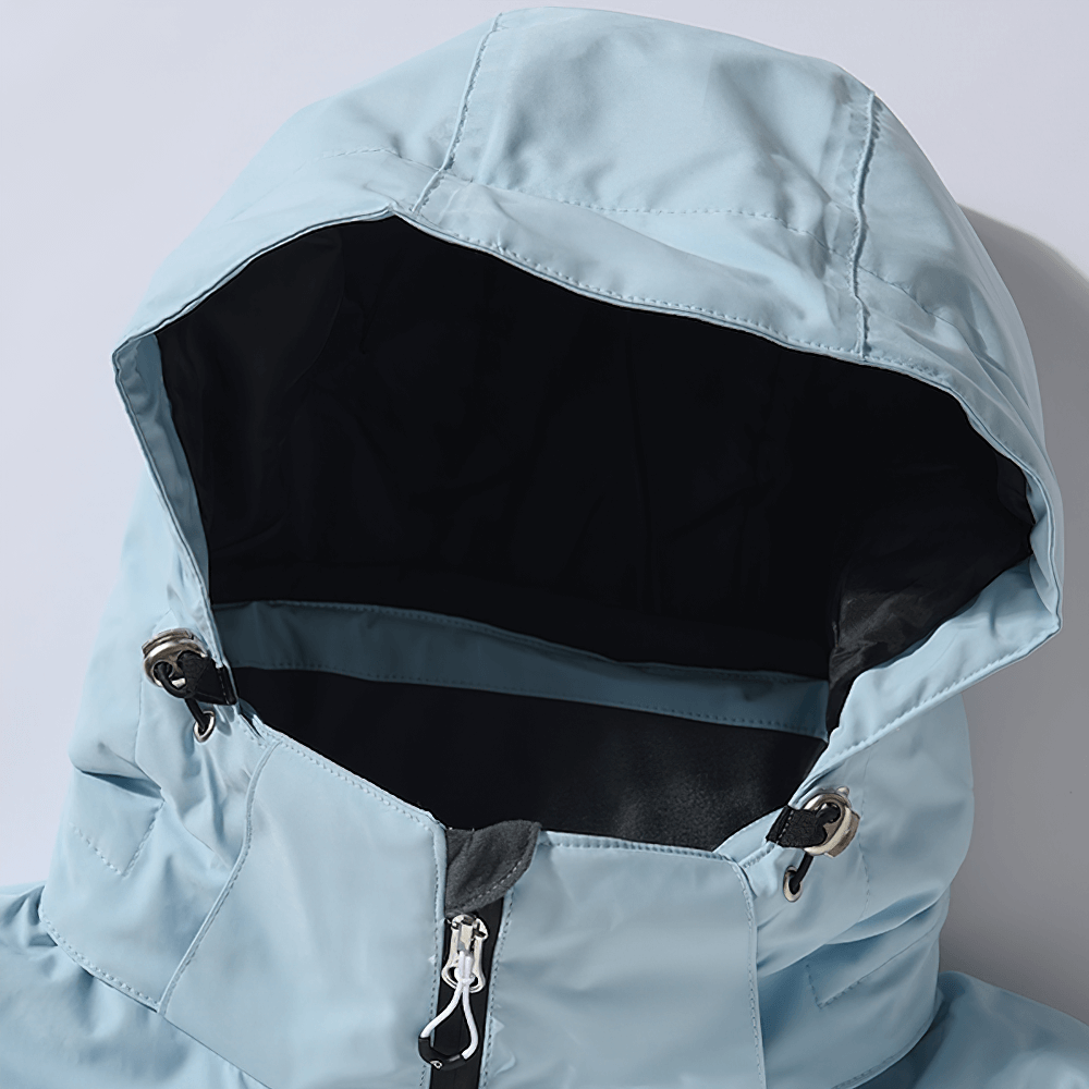 Close-up of a waterproof hooded ski jacket with detachable hood, featuring a secure zip and windproof design for outdoor sports.