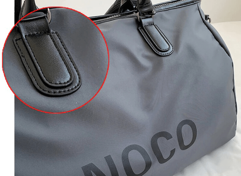 Close-up of a waterproof unisex sports shoulder bag showcasing durable nylon material and reinforced stitching, perfect for fitness and travel.