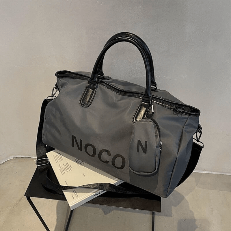 Waterproof large unisex shoulder sports handbag in gray, ideal for fitness and travel; stylish and durable nylon with black accents.