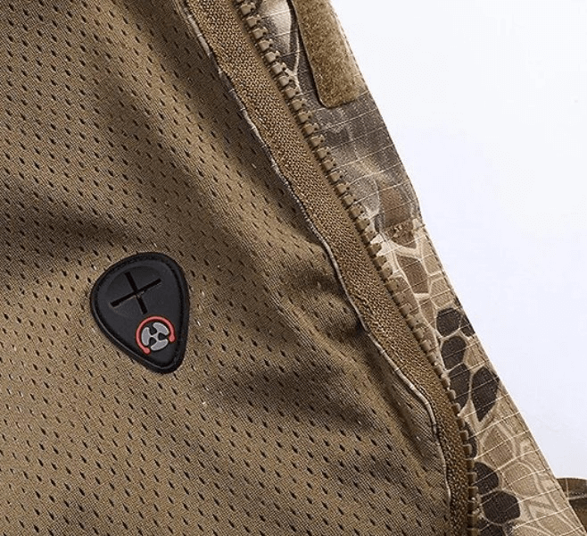 Close-up of detailed stitching on a camouflage waterproof men's windbreaker with breathable design and zippered pocket.
