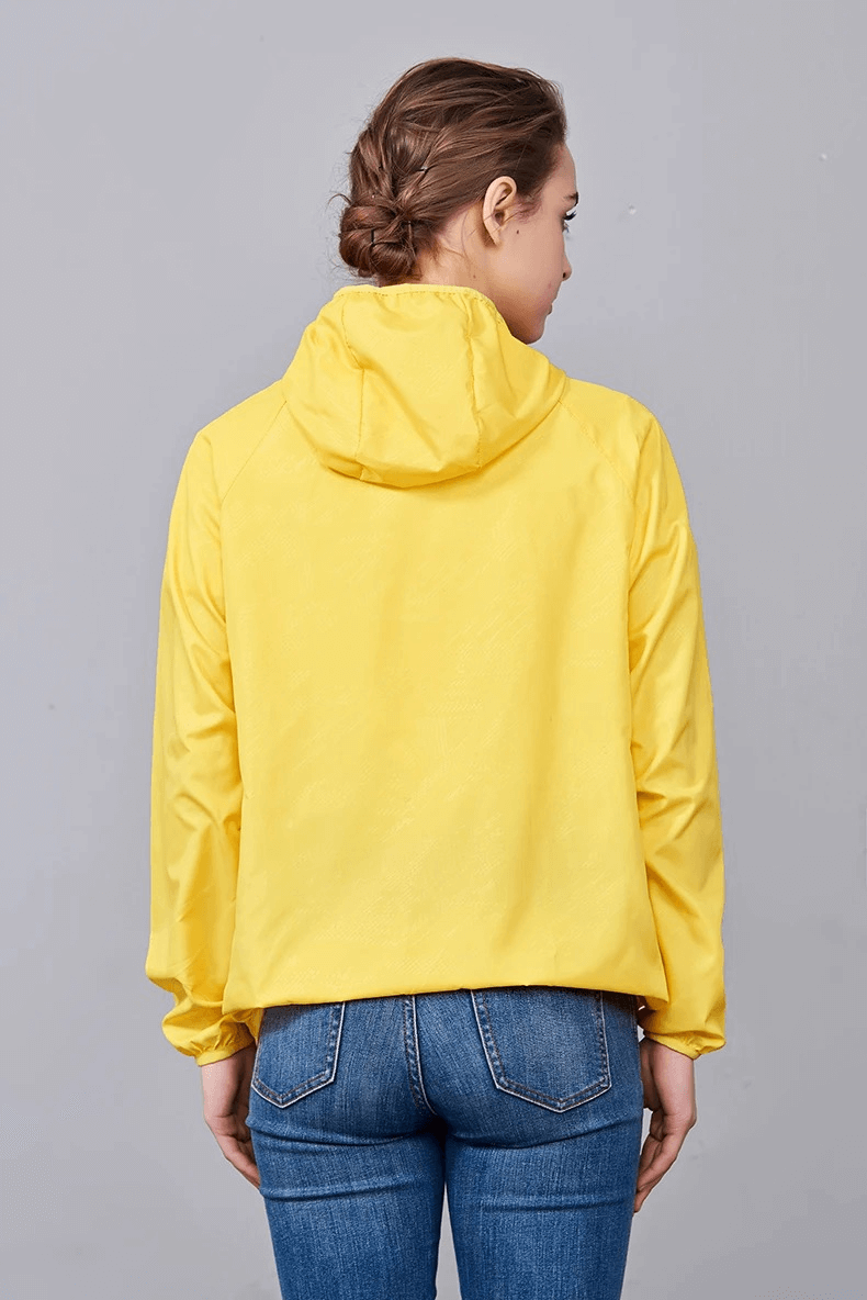 Yellow waterproof polyester hiking jacket, breathable and sun-protective, modeled from the back view.