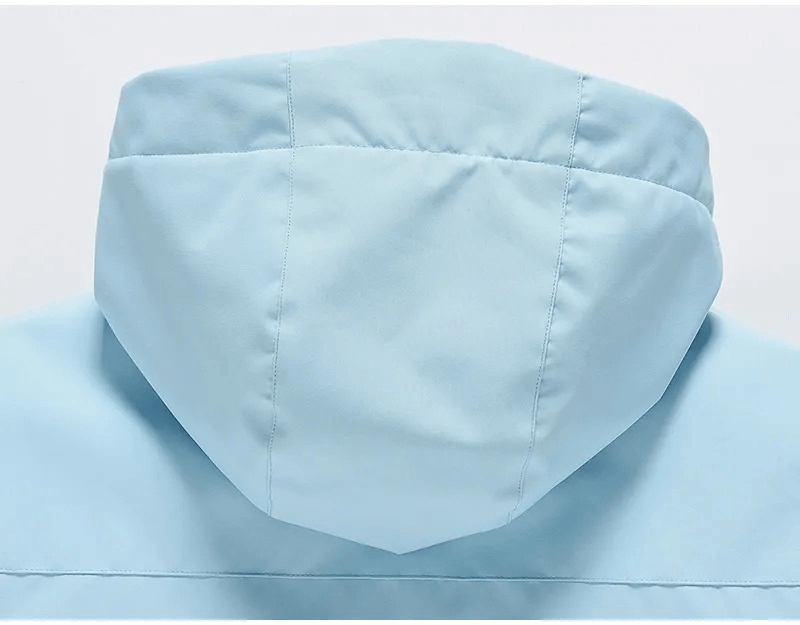 Alt Tag: Back view of light blue waterproof ski jacket hood, unisex design, perfect for outdoor winter activities, style SF1807.