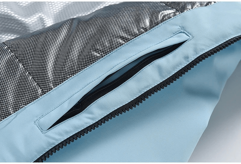 Close-up of waterproof ski jacket's zippered pocket, showcasing the durable fabric and stylish design. Perfect for winter sports.