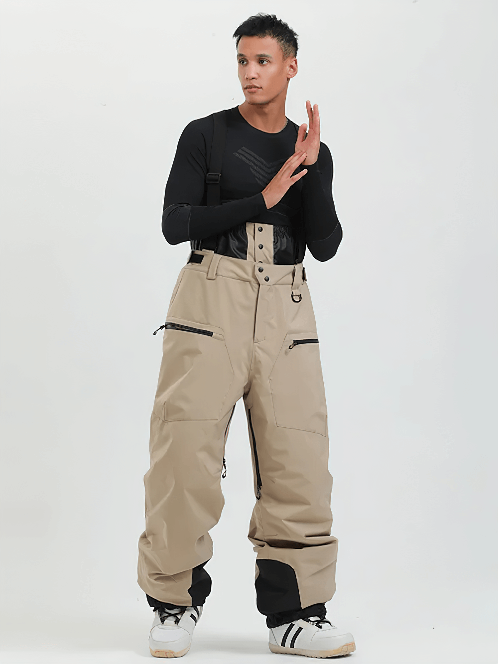 Model wearing Waterproof Ski Pants with Adjustable Suspenders - SF4272, showcasing zippered pockets and reinforced cuffs for skiing.